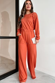 42% POLYESTER, 40% COTTON, 18% RAYON Model Wearing Size Small Color: Rust Soft, French Terry Knit V-Back Long Sleeves Elastic Waistband Side Pockets Relaxed/Wide Leg Fit Jumpsuit Has Stretch 19" Armpit To Sleeve End 32" Inseam For Model Size Specs Please Check Size Charts Launched: 1/28/24 Solid Relaxed Fit Jumpsuits And Rompers For Fall, Orange Long Sleeve Jumpsuit For Fall, Casual Long Sleeve Jumpsuits And Rompers With Elastic Waistband, Fall Relaxed Fit Jumpsuits And Rompers In Solid Color, Fall Relaxed Fit Jumpsuits And Rompers, Casual Solid Jumpsuits And Rompers For Fall, Casual Orange Stretch Jumpsuits And Rompers, Casual Stretch Orange Jumpsuit, Casual Orange Stretch Jumpsuit