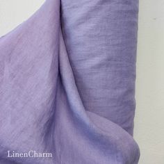 a close up view of a lavender colored linen material that is very soft and drab