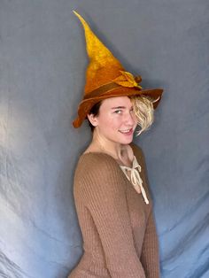 This autumnal witch hat is for the witch in your life who loves the changing of the seasons, or to go the extra mile in your costume this year. The brim has intentional holes to show the wear and tear of a true, age-defying witch. Wet felted for a long lasting, structured feel. Made from 100% merino wool. Perfect for cosplay, everyday witching, dress-up, fashion, or LARPing. Fall Costume Hats With Curved Brim, Halloween Fedora For Costume Party, Fedora Hat For Halloween Costume Party, Fedora Costume Hat For Halloween Party, Fedora Costume Hats For Halloween Costume Party, Witchy Wide Brim Hat For Fall, Fitted Hat For Costume, Fall Season, Fitted Hat For Costume And Fall Season, Fitted Hats For Costume Events In Fall