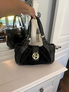 Vintage Tommy Hilfiger leather and corduroy black shoulder bag with brass hardware including rivet details. Large brass TH insignia medallion on closure strap. Magnetic closure.  14"W x 8"T with a 10" strap drop. Magnetic closure, roomy open interior with black fabric, 1 side wall zip and 2 slide in pockets. excellent pre-owned condition, freshly cleaned. Trendy Y2K vintage bag for fall and winter! If you are seeing higher than expected shipping fees at checkout, please reach out and I will see Vintage Tommy Hilfiger, Black Purse, Side Wall, Bag Collection, Y2k Vintage, Vintage Bag, Black Shoulder Bag, Black Purses, Vintage Bags