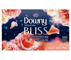 an advertisement for downy inflisions bliss with pink roses and water droplets