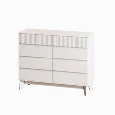 a white dresser sitting on top of a white floor