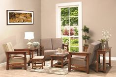 a living room filled with furniture next to a large window and a wooden table in front of it