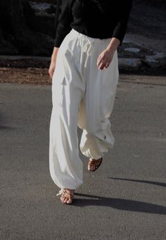 The Cooper Cargo Pant in our perennial favorite fabric, silk canvas, features a structured yet warm silk hand quintessentially perfect across all seasons. The Cooper features a comfortable yet elegant elastic + drawstring waistline, easy side and utilitarian pockets, and adjustable ties at the bottom to allow for a balloon silhouette or wide leg fit. We truly love this updated classic for its ease of styling and functionality - the Cooper Cargos share endless possibilities from day to evening af Balloon Silhouette, House Items, Balloon Pants, Beach Side, Easy Sides, Cropped Pullover, Cargo Pant, Fabric Silk, Tie Top