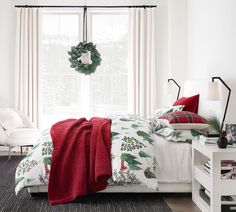 a bedroom with white walls and christmas decorations