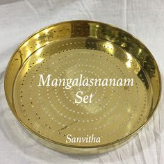 a brass plate with the words manggalasanananam set written on it