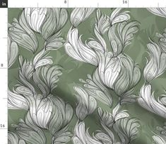 a green and white wallpaper with large leaves on the side, as well as a ruler