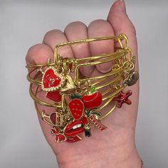 Red And Gold Charm Bangle Bracelet Please Note, You Will Receive 1 Bracelet That Will Be Chosen At Random Comes With 4 Charms Of Red And Gold Hand Made Trendy Red Bangle Jewelry, Valentine's Day Bangle Charm Bracelet, Adjustable Red Bracelets With Charms, Adjustable Nickel-free Red Charm Bracelet, Red Nickel-free Charm Bracelet As Gift, Red Nickel-free Charm Bracelet For Gift, Red Charm Bracelet With Lobster Clasp As Gift, Red Metal Bracelets For Gift, Red Metal Bracelets As Gift