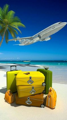 an airplane is flying over the beach with suitcases