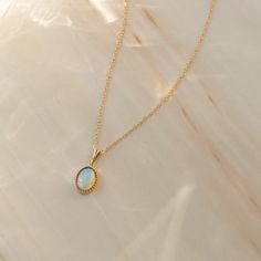 Make a sparkly statement with the Oval Opal Necklace. This gorgeous necklace is crafted in solid 14k gold and a gorgeous Australian opal, encased by a beaded bezel. It will bring luxury into your every day - from your day in the office, to brunch with the girls, to a night out on the town. You can easily dress it up or down, and its timeless design is sure to get you compliments throughout your day! You'll love how radiant you feel when you wear this stunning necklace, and you can even pass it d Opal Necklace Vintage, Gold Opal Necklace, Australian Opal Jewelry, Solid Gold Necklace, Opal Color, Accessories Ideas, Stunning Necklace, Opal Ring, Australian Opal