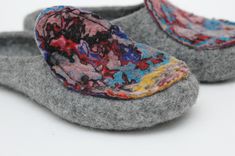 Felted slippers for women - excellent gift for birthday or housewarming These cute grey slippers are decorated with colored handmade felt sewed on. They are all fully handmade. PLEASE NOTE: all slippers will differ, decoration can have another coloration or scale. Each pair is one of a kind. Felt is a perfect material for footwear. It is extremely wear proof and warm. When you put them on, you won't want to take the slippers off. They will definitely make a part of your home outfit. Non-slip sol Multicolor Non-slip Flat Slippers, Multicolor Slip-on Slippers For Indoor, Multicolor Non-slip Slip-on Slippers, Handmade Comfortable Slippers With Round Toe, Comfortable Multicolor Flat Slippers, Handmade Round Toe Slippers For Gifts, Comfortable Multicolor Slip-on Slippers, Gray Non-slip Closed Toe Slippers, Handmade Casual Slippers As A Gift