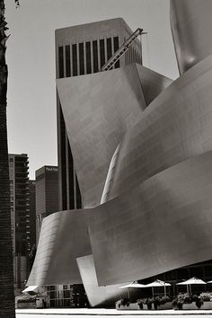 black and white photograph of the exterior of walt concert hall in los angeles, california