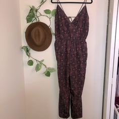 Paisley Print Jumpsuit By Mimi Chica. Maroon And Black Color. Spaghetti Straps. Open Back With Tie. Pockets. Ankle/Tapered. V-Neck. Stretches At The Waist. Size L. Approx Measurements: Length (56 In), Armpit To Armpit (18 In), Waist (16 In). Excellent Condition. New Without Tags. Casual Summer Paisley Print Jumpsuits And Rompers, Casual Paisley Print Jumpsuits And Rompers For Summer, Casual Paisley Print Jumpsuit For Summer, Casual Paisley Print Jumpsuits And Rompers For Spring, Casual Spring Jumpsuits And Rompers With Paisley Print, Print Jumpsuit, Neck Stretches, Paisley Print, Waist Size