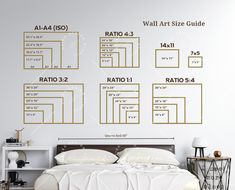 a white bed sitting next to a wall with measurements on it