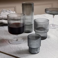 The Ripple Glasses are a testament to the artistry of contemporary Danish glass design. The set includes four Ripple glasses, each showcasing the same captivating ripple pattern. With Keltür's Ripple glasses, your tableware is not just functional; it's a work of art that adds elegance to every sip and occasion. Modern Drinking Glasses, Design Online Shop, Modern Tableware, Small Glasses, Long Drink, Glasses Drinking, Wine Glass Set, Ferm Living, Glass Cup