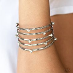 Sporadically dotted in glassy white rhinestones, thick silver bars stack across the wrist, coalescing into a statement-making cuff. Sold as one individual bracelet. P9RE-WTXX-309XX Wire Cuff, Sparkle Bracelet, White Bracelet, White Bracelets, Paparazzi Accessories, White Rhinestone, Silver Bars, Paparazzi Jewelry, Affordable Jewelry