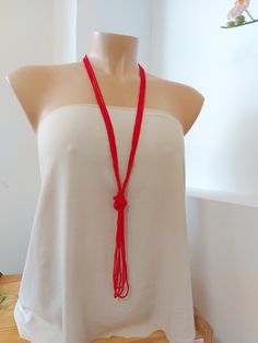 "This is a pinky red color, very boho necklace that measures about 44 inches long in total. The knot is adjustable, simple to undo and redo at the height you would like! Or you can wear the necklace double up without any knot! It is a very versatile necklace that can be adapted to your taste. ❤ PROCESSING AND SHIPPING Most orders are made and shipped out in one business day. Please check delivery timeframes for your location on the description below. ❤ CUSTOM ORDERS If you like this item in a di Handmade Red Beaded Lariat Necklace, Red Bohemian Lariat Necklace, Handmade Red Long Necklace, Handmade Long Red Necklace, Elegant Handmade Red Long Necklace, Bohemian Red Necklaces For The Beach, Red Bohemian Long Necklace For Gift, Red Bohemian Necklace For Beach, Bohemian Red Long Necklace For Gift