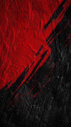 an abstract red and black background with paint strokes on it's edges in the center