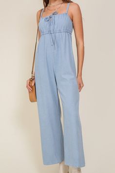 THE PERFECT MIX OF FLIRTY AND FUN, THIS JUMPSUIT IS READY FOR ANY SUMMER OCCASIONS. THE FLOWY SILHOUETTE IS COMPLEMENTED BY A SQUARE NECK LINE, RUCHED BUST, AND FRONT KEYHOLE DETAILS. WHETHER YOU ARE SIPPING COCKTAILS OR DANCING THE NIGHT AWAY, THIS DENIM BLUE JUMPSUIT WILL HAVE YOU FEELING THE BEST.* SLEEVELESS DESIGN* SPAGHETTI STRAP* SELF FRONT TIE* FRONT KEY HOLE* LIGHTWEIGHT MATERIAL* THE MODEL IS 5'9" AND WEARING SIZE SMALLMade In: ChinaFabric Contents: 90% cotton 10% viscoseSize Measureme Solid Sleeveless Denim Jumpsuit For Summer, Sleeveless Solid Denim Jumpsuit For Summer, Summer Cotton Denim Jumpsuit, Solid Cotton Denim Jumpsuit For Summer, Trendy Solid Color Denim Jumpsuit For Summer, Light Blue Relaxed Fit Denim Top For Summer, Light Blue Cotton Summer Jumpsuits And Rompers, Chic Light Wash Cotton Jumpsuits And Rompers, Light Blue Cotton Summer Jumpsuit