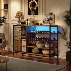 a living room filled with lots of furniture and decor on top of a hard wood floor