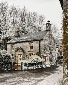 an old stone house in the middle of winter