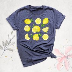 "Lemon Cottage Core Shirt, Women Aesthetic Shirt, Summer Shirt, Botanical Shirt, Lemon Festival Shirt, Citrus Fruit Shirt, Lemon Farmer Shirt Hello, Thanks for your support. Your gladness comes first and all work is done with Love in here. Always keep your support, please:) Lemon Cottage Core Shirts are branded Bella+Canvas.  Lemon Cottage Core Shirt  Contents: - Solid colors: %100 Cotton.  - Heather colors: %52 Cotton + %48 Polyester* This ultra-soft graphic tee is made from a comfortable cotton-poly blend that is breathable, non-shrinking, and lasts longer than your average graphic shirt. HOW TO ORDER YOUR LEMON COTTAGE CORE SHIRT  -Please, Check and Review all  Lemon Cottage Core Shirt Photos. -Select Your Lemon Cottage Core Shirt T-Shirt Size and Lemon Cottage Core Shirt T-Shirt Color Casual Cotton T-shirt With Lemon Print, Short Sleeve Lemon Print Graphic Tee, Summer Lemon Print Graphic Tee, Cotton T-shirt With Lemon Print, Short Sleeve, Cotton Short Sleeve T-shirt With Lemon Print, Cotton Graphic Tee With Lemon Print, Spring Cotton T-shirt With Lemon Print, Summer Short Sleeve T-shirt With Lemon Print, Short Sleeve Lemon Print T-shirt For Summer