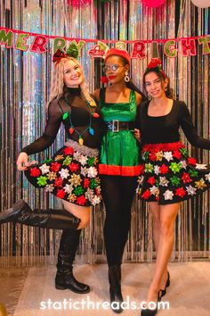 three women dressed in christmas costumes posing for the camera