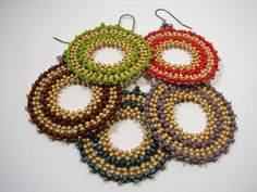 "Boho - Hippie Earrings offered in 5 Colors. Made  with 11/0 & 8/0 Round Toho seed beads, these earrings reflect a care-free style and is  lovely for beach and summer wear.  They are made with warm  earth colors. They are 2 1/2\" from the top of the ear wire, and 1 3/4 circle\". The earwires are stainless steel 21 gage. The Colors are lime green, brown, red, blue, violet." Earth Colors, Hippie Earrings, Earrings Round, Earrings Large, Earrings Hoop, Green Earrings, Seed Bead Earrings, Large Earrings, Bead Earrings