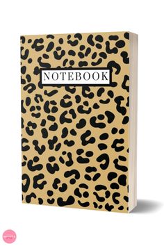 the leopard print notebook is shown with black and white writing on it, which reads notebook