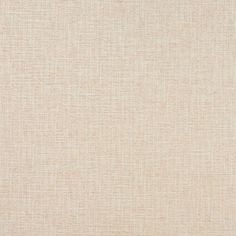 a plain beige fabric textured upholstered to the wall with no visible pattern