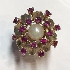 Vintage 14k Yellow Gold,16, 20 Pt. Rubies 7mm Pearl Ring Size re sized to 3-3/4. Condition is "Pre-owned". This is some piece. Substantial at 9.5 grams and a combined over 3 carats in rubies. Yep, nice ring. Appreciate the view. Any questions please feel free to ask. Item shown is exact item you will receive...Unless this listing has a quantity available. ABSOLUTELY NO INTERNATIONAL SHIPPING!!! All Reasonable offer considered. Estate Style Round Jewelry Gift, Estate Jewelry Ring With Center Stone, Formal Round Ruby Ring Stamped 14k, Estate Jewelry With Prong Setting In Round Shape, Estate Jewelry With Prong Setting, Estate Yellow Gold Round Jewelry, Estate Jewelry With Prong Setting And Round Cut, Estate Jewelry With Round Cut Prong Setting, White Ruby Ring In 14k Gold