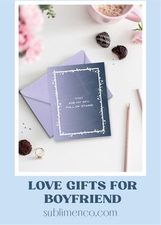 love gifts for him on top of a table with pink flowers and chocolates in the background