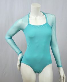 Square Halter Neckline - Aquamarine base milliskin fabric - Aquamarine stretch mesh sleeves - Open deep scoop neck back This listing includes USPS First Class Shipping throughout the US. Additional shipping charges apply to international orders. Long Sleeve Bodysuit For Dance, Solid Long Sleeve Bodysuit For Dance, Solid Color Long Sleeve Bodysuit For Dance, Stretch Long Sleeve Unitard With Thumbholes, Long Sleeve Leotard For Dance, Long Sleeve Nylon Swimwear For Summer, Long Sleeve Dance Bodysuit With Thumbholes, High Stretch Summer Nylon Leotard, Solid Unitard With Thumbholes For Dancewear