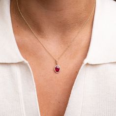 Take their breath away with our new 14k Oval Ruby necklace. Our ruby pendant necklace is incredibly romantic, featuring a classic style that centers around a brilliant, oval ruby that’s encrusted with diamonds. Boasting an elegant and regal flare, this ruby pendant drips with the timeless romance of a modern heirloom. Featuring a 1.25 Carat oval Ruby illuminated by 28 glowing genuine and ethically sourced diamonds.Material: 14k Recycled Gold, Genuine Diamonds and RubyChain: 14k Cable ChainRuby C Oval Ruby Necklace With Brilliant Cut, Elegant Ruby Necklace With Oval Pendant, Elegant Ruby Oval Pendant Necklace, Elegant Ruby Necklace With Halo Setting, Fine Jewelry Ruby Necklace With Oval Pendant, Fine Jewelry Ruby Oval Pendant Necklace, Ruby Oval Pendant Fine Jewelry Necklace, Ruby Pendant Necklace, Ruby Necklace Pendant