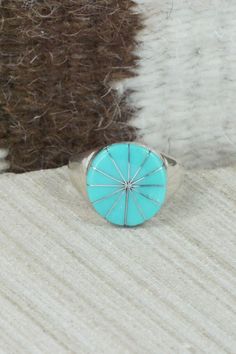 This turquoise and sterling silver inlay ring was made by Zuni silversmith Johnson Laweka. The inside is signed JL.Size: 9.5Length: 5/8"Width: 5/8"Free shipping on all orders! We ship with USPS and always include tracking. All orders ship within a day of payment.Returns are accepted up to 30 days after you receive your order. Just send us a message. Our shop offers cash back or store credit. The item must be returned in new condition. Turquoise Inlay Ring As A Gift, Turquoise Inlay Ring As Gift, Turquoise Inlay Ring Gift, Turquoise Inlay Ring For Gift, Turquoise Inlay Round Rings, Southwestern Style Turquoise Inlay Ring, Unique Blue Turquoise Ring With Inlay, Blue Turquoise Ring With Inlay, Southwestern Style Polished Turquoise Ring