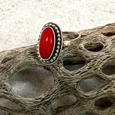 Bright red Coral gemstone set in sterling silver ring, made to your size. Love a little pop of color?  One of these coral rings is the perfect addition to your jewery lineup.   These coral settings are unfinished so you can choose to have one finished in the ring size of your choice. Your ring will be finished with a hammered band as shown in the pictures (band is not yet soldered).  Having a hammered single band allows you to wear your ring with other stacking bands you may own. The settings are 1/2 X 3/4 inches.  The coral stones are surrounded by a fine silver bezel, set in sterling silver and accented with either a twist or bead wire. Choose your favorite look and I will use that exact setting.  These little lovelies are designed and made by me in my Arizona studio. Arriving in one of Adjustable Oval Red Ring, Adjustable Red Oval Ring, Red Nickel Free Rings, Nickel-free Red Rings, Classic Adjustable Red Ring, Adjustable Oval Red Ruby Ring, Adjustable Red Oval Ruby Ring, Handmade Adjustable Red Ruby Ring, Red Open Ring Stackable Rings For Gift