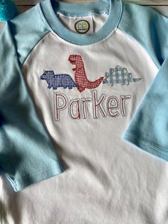 🦖 These Dino's will be sure to make your little one rawr with delight. 🦕  🦖 Appliqué features three dinosaurs in ginghams, on a 100% cotton raglan sleeve tee, and features the adorable Double Portion font. 🦕  🦖 As always, this is completely customizable. Want a different tee? No problem, need the dinos more girly? We can do that too! Message us and we will get you exactly what you want! 🦕 Cute Gingham Long Sleeve Tops, Playful Cotton Patchwork Tops, Playful Patchwork Cotton Tops, Long Sleeve Cotton Tops With Dinosaur Print, Long Sleeve Cotton Top With Dinosaur Print, Cotton Long Sleeve Tops With Dinosaur Print, Playful Cotton T-shirt With Dinosaur Print, Spring Playtime Tops With Dinosaur Print, Long Sleeve Tops With Dinosaur Print For Playtime