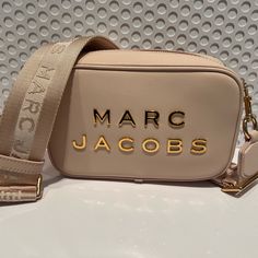 Marc Jacobs Rose Pink Dtm Camera Bag Chic Crossbody Shoulder Bag With Logo, Chic Logo Rectangular Shoulder Bag, Luxury Blush Rectangular Shoulder Bag, Modern Pink Shoulder Bag With Logo, Luxury Blush Rectangular Bag, Modern Blush Rectangular Bag, Luxury Blush Bag With Detachable Strap, Gold Crossbody Bag With Logo, Gold Logo Crossbody Bag