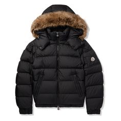 Moncler's 'Maya' jacket is instantly recognisable by its boxy silhouette and faux fur-trimmed hood. Made from black shell and filled with insulating down, it's detailed with a patch pocket and emblem at the sleeve. The side zip-pockets are roomy enough to hold all of your essentials. Luxury Parka With Faux Fur Trim, Luxury Parka With Faux Fur Lining For Winter, Luxury Outerwear With Faux Fur Trim And Down Material, Luxury Hooded Parka With Faux Fur Trim, Luxury Hooded Jacket With Padded Collar, Luxury Puffer Jacket With Padded Collar For Cold Weather, Luxury Down Outerwear With Detachable Hood, Luxury Winter Hooded Jacket With Padded Collar, Luxury Faux Fur Trim Outerwear For Cold Weather