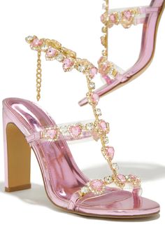 Ezylynn - Pink is the perfect balance between fashion and function. It features a metallic pink finish and pretty in pink heart stone embellishments. This stylish piece offers an eye-catching design while remaining functional and comfortable. Stock Unit: 27A1 SIZE & FIT Heel Height Approx: 4" Shoe Model Suggestion: Gold And Pink Heels, Mermaid Shoes High Heels, Pink 2000s Fashion, Pink And Gold Heels, Pink Glamorous Synthetic Heels, Glamorous Pink Synthetic Heels, Pink Synthetic Heels For Wedding, Pink Crystal Embellished Heels, Pink Rhinestone Round Toe Heels