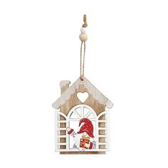 a wooden house ornament with a santa clause on it