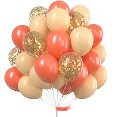 a bunch of balloons that are in the shape of a tree with gold and red decorations