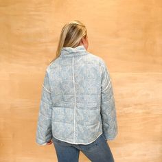 Stay trendy and fresh with our Fresh Out Floral Jacket in Blue! This classic quilted jacket features a playful floral design perfect for fall. Don't miss out on adding some fun to your wardrobe with this must-have piece! Ashley is 5'4" and is wearing a size medium.