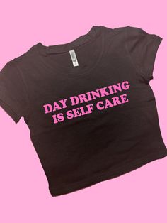 Day Drinking Is Self Care SNUG FIT Crop Top | Graphic Top | Gift For Her | Y2K Baby Tee | Y2K crop top | Gift for friend | Funny Slogan | Comfy Top to Lounge in! Actual item may be lighter/darker than pictured. M A T E R I A L S - SNUG FIT - 100% RING SPUN COTTON - Shoulder Taping S I Z I N G - Size chart is available on our listing photos. S H I P P I N G  &  P R O D U C T I O N  T I M E - Production Time is 5 Business Days. (May be delayed during the Holiday Season) - Shipping Time is 2-6 Busi Trendy Crew Neck Crop Top With Screen Print, Fitted Crew Neck Crop Top With Funny Text, Pink Cropped Graphic T-shirt, Black Fitted Crop Top With Slogan, Pink Slogan Cropped T-shirt With Crew Neck, Pink Y2k Crop Top With Letter Print, Black Y2k Cropped Shirt With Crew Neck, Trendy Pink Cropped Shirt With Letter Print, Trendy Cropped Tops With Screen Print