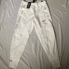 Nwt Hard To Find Team Usa White Tapered Leg Joggers With Pockets, Nike White Cotton Joggers, White Cotton Nike Joggers, White Tapered Leg Cargo Pants For Spring, Nike Sporty White Pants, Nike Casual White Pants, Nike White Pants For Spring, Nike White Joggers For Spring, Gray Sweatpants Man