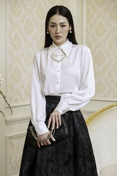 This shirt is perfect for any professional occasion. Cut with a straight silhouette and Bishop sleeves, this midi shirt offers a sophisticated style that looks great paired with everything from office trousers to evening skirts. Elegant Fitted Button-up Shirt, Chic Semi-formal Blouse With Lapel Collar, Elegant Semi-formal Tops With Lapel Collar, Chic Blouse With Lapel Collar For Office, Chic Office Blouse With Lapel Collar, Chic Button-up Shirt For Office, Chic Office Shirt For Fall, Formal Fall Blouse With Collared Neckline, Semi-formal Fall Office Lady Blouse