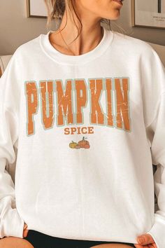 PUMPKIN SPICE GRAPHIC SWEATSHIRT- PREMIUM 50/50 PRESHRUNK COTTON/ POLYESTER- HEATHERED COLORS - 60/40 POLYESTER /COTTON- AIR JET YARN FOR SOFTER FEEL AND REDUCED PILLING- CLASSIC FIT- UNISEX SIZING- TEAR-AWAY LABELMade In: USAFabric Contents: 50% COTTON, 50% POLYESTER White Fall Sweater For College, White Long Sleeve Sweater With Letter Print, White Long Sleeve Sweater For College, White Long Sleeve College Sweater, Trendy White Crew Neck Sweater, White Cotton College Sweater, Trendy White Sweatshirt For Fall, White Crew Neck Sweater For College, Oversized White Sweater For College