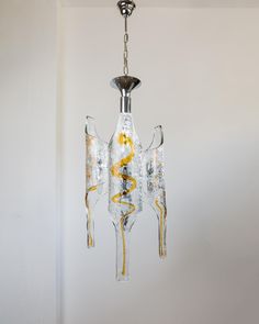 This impressive XXL vintage chandelier made of Murano glass by Toni Zuccheri for Mazzega from the 1970s combines elegance and contemporary design. With clear and amber-colored glass and a chrome element, this chandelier is a real highlight for your home. The harmonious combination of colors and materials gives your room a touch of mid-century modern and space age design. Ideal as stylish lighting for the living room, bedroom, office or dining room. On request, we will be happy to adapt the lamp Mcm Ceiling, Lustre Vintage, Space Age Design, Table Cafe, Murano Glass Chandelier, Lamp Socket, Vintage Chandelier, Space Age, Glass Chandelier