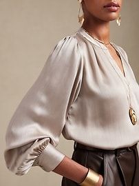 Elegant V-neck Top With Cuffed Sleeves, Chic Band Neckline Tops For Work, Chic Tops With Band Neckline For Workwear, Chic Workwear Tops With Band Neckline, Elegant Blouse With Band Neckline For Work, Elegant Band Neckline Tops For Workwear, Elegant Split Neck Office Blouse, Chic Split Neck Blouse For Daywear, Elegant Daywear Blouse With Split Neck