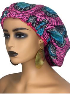 Elevate your sleepwear with this stunning African pattern Ankara sleeping bonnet cap. Perfect for all seasons, this bonnet features a beautiful floral pattern and Ankara accents, adding elegance to your night routine. This bonnet is soft and comfortable all night and is made with high-quality satin silk fabric. The one-size regular fit and elastic band ensure a secure and comfortable fit for all head sizes. This bonnet is versatile and can be worn as activewear or casual wear. Add it to your collection of women's accessories and enjoy a stylish and comfortable night's sleep. Head circle: 38cm ( one size fits all) Material: Satin Silk, Polyester Pink Bonnet One Size Fits Most, Pink One Size Bonnet, Pink Headscarf, Ankara Pattern, Sleeping Bonnet, Bonnet Cap, African Pattern, Night Routine, Satin Silk